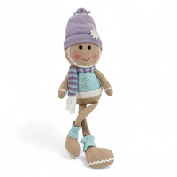 Charming winter-themed fabric doll with purple hat, striped scarf, and snowflake details for home décor