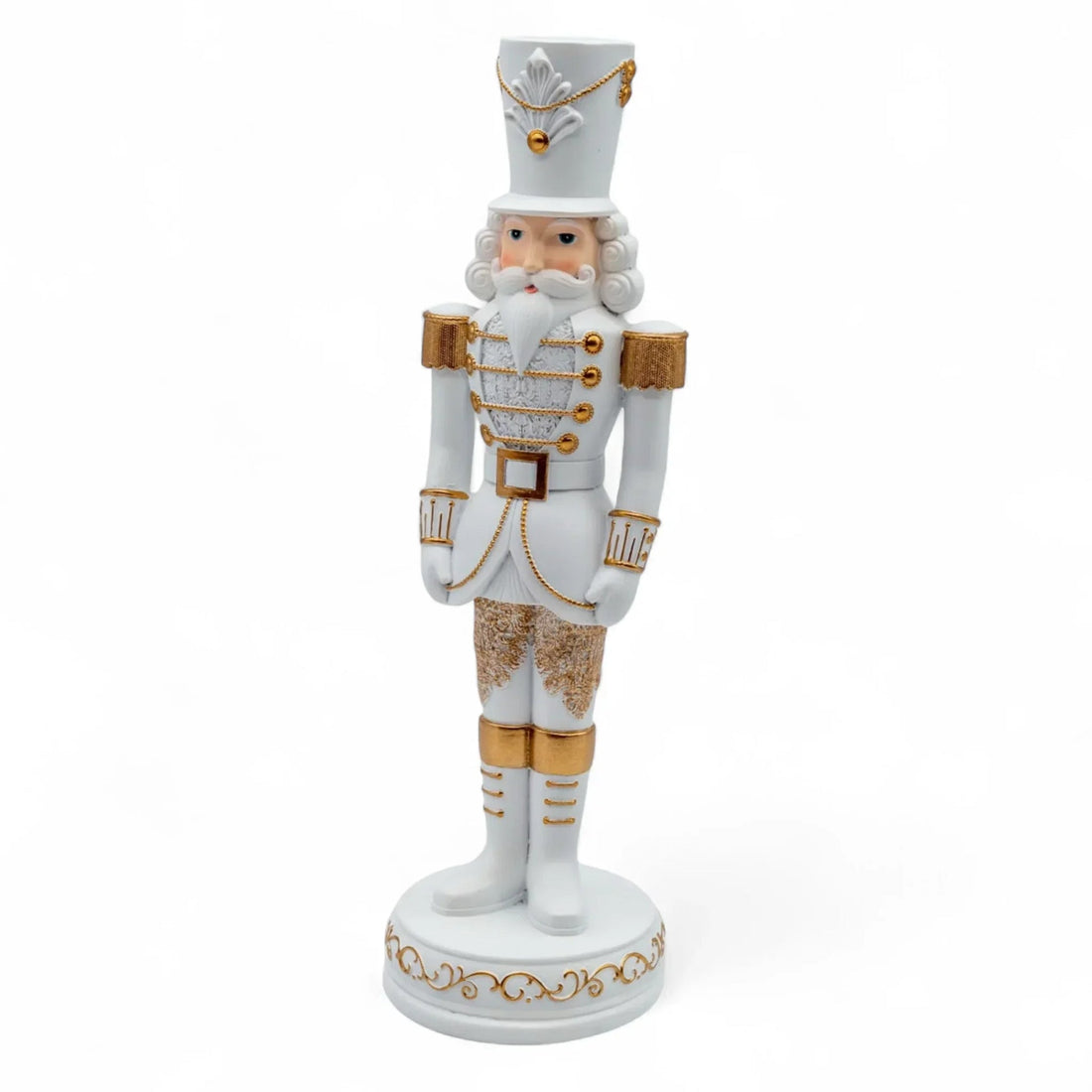 White and gold nutcracker soldier figurine, elegant Christmas holiday decoration with detailed uniform and base