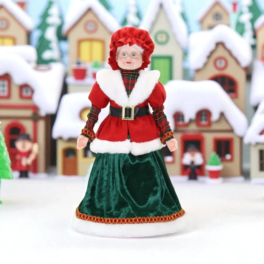 Festive Mrs. Claus figurine in red and green velvet, perfect for Christmas home décor and holiday displays.