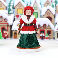 Festive Mrs. Claus figurine in red and green velvet, perfect for Christmas home décor and holiday displays.