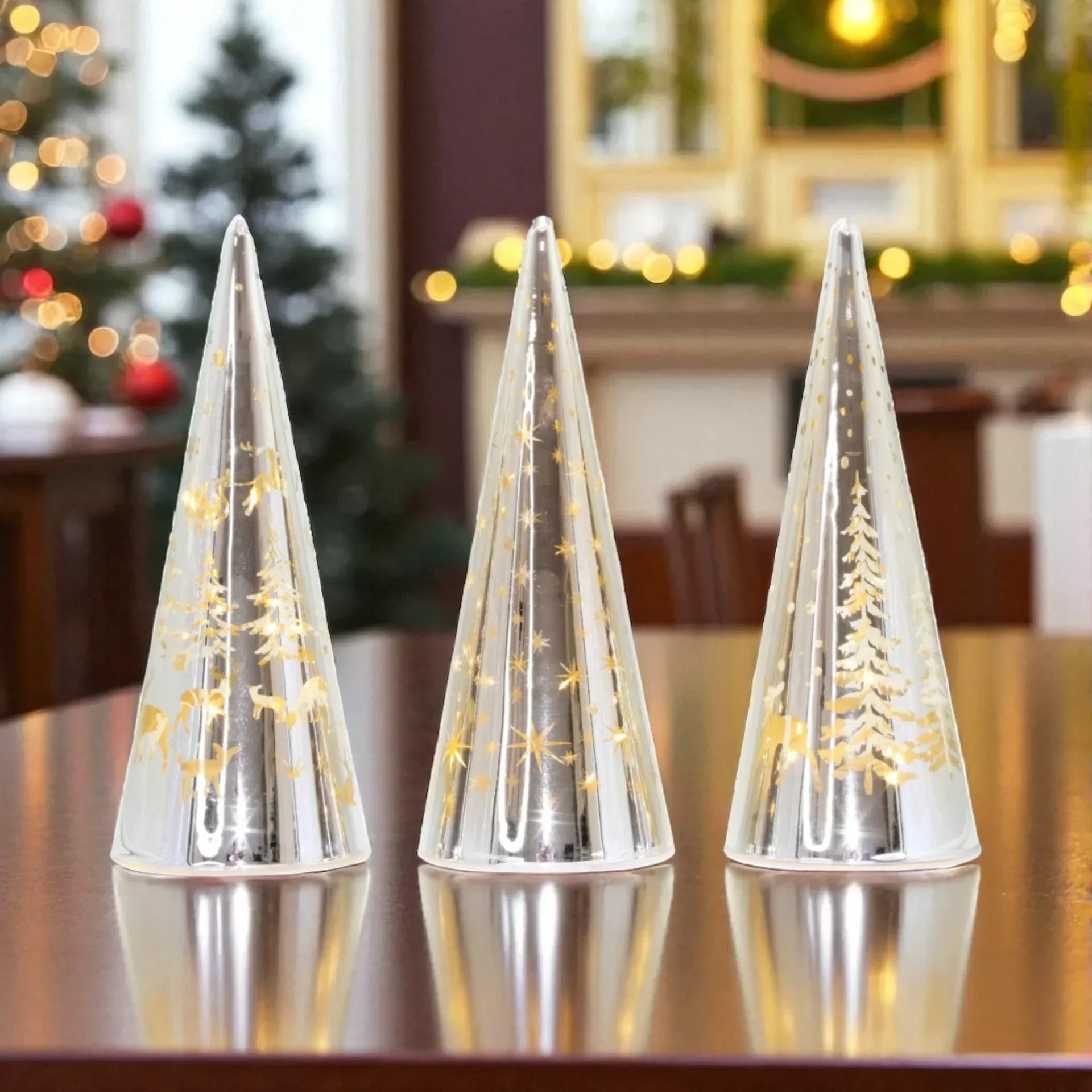 Set of 3 clear glass Christmas tree decorations with gold reindeer, stars, and trees, perfect for festive home décor.