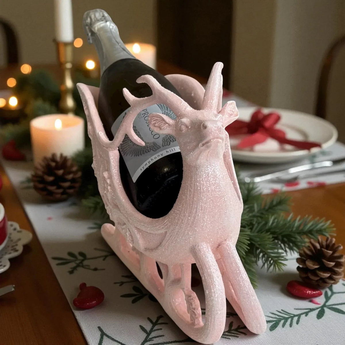 Pink glitter reindeer wine bottle holder for festive table decor, holiday home accents