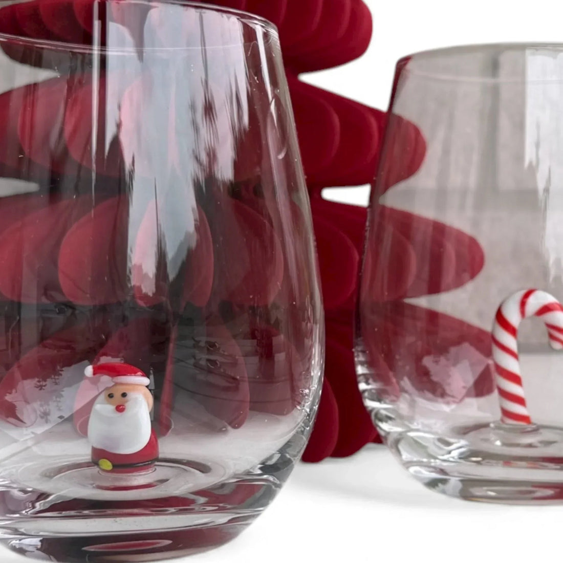 Festive glassware with Santa and candy cane designs for holiday home décor
