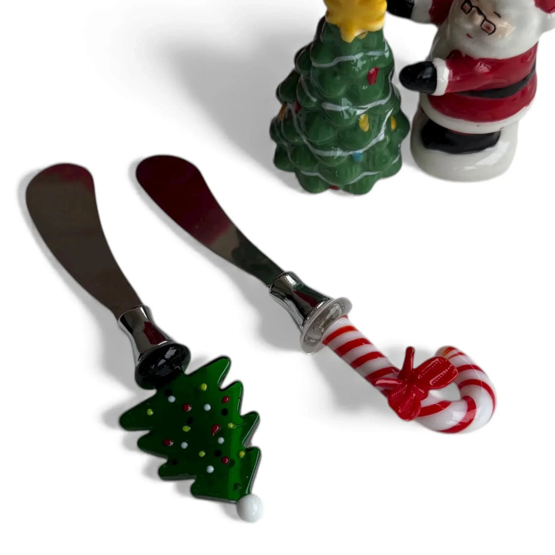 Festive Christmas tree and candy cane butter knives with holiday-themed handles