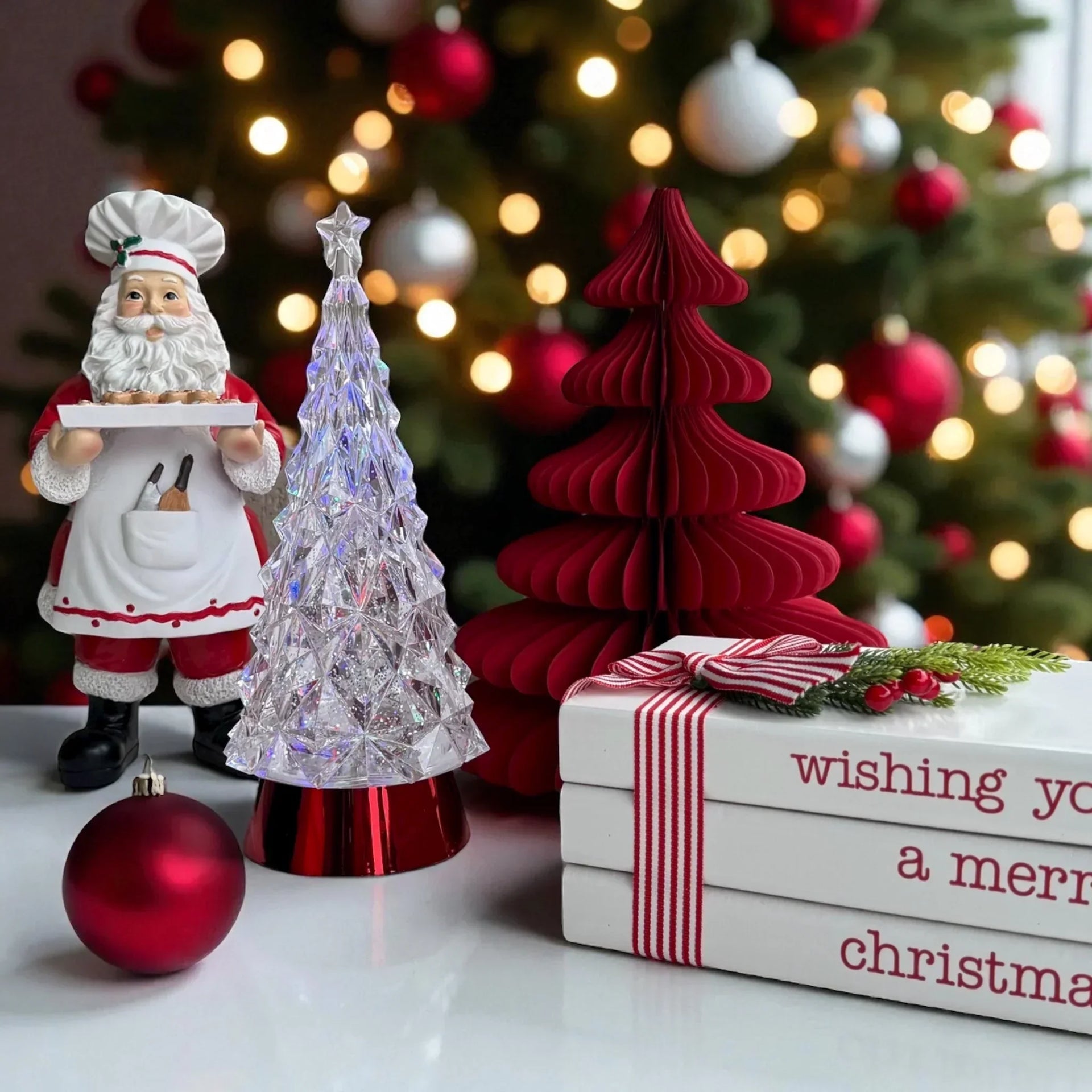 Santa chef figurine, crystal and red paper Christmas trees, gift box with festive ribbon, holiday decor