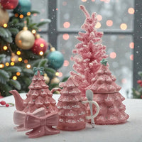 Pink ceramic Christmas tree tea set with matching sugar bowl, mug, and festive ornaments, perfect for holiday home décor.