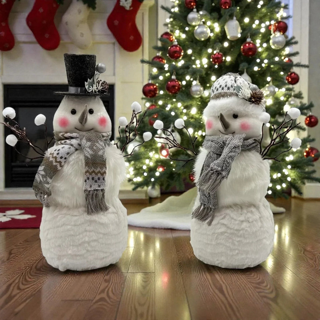 Charming snowman decorations with scarves and hats, perfect for Christmas home décor near a lit tree.