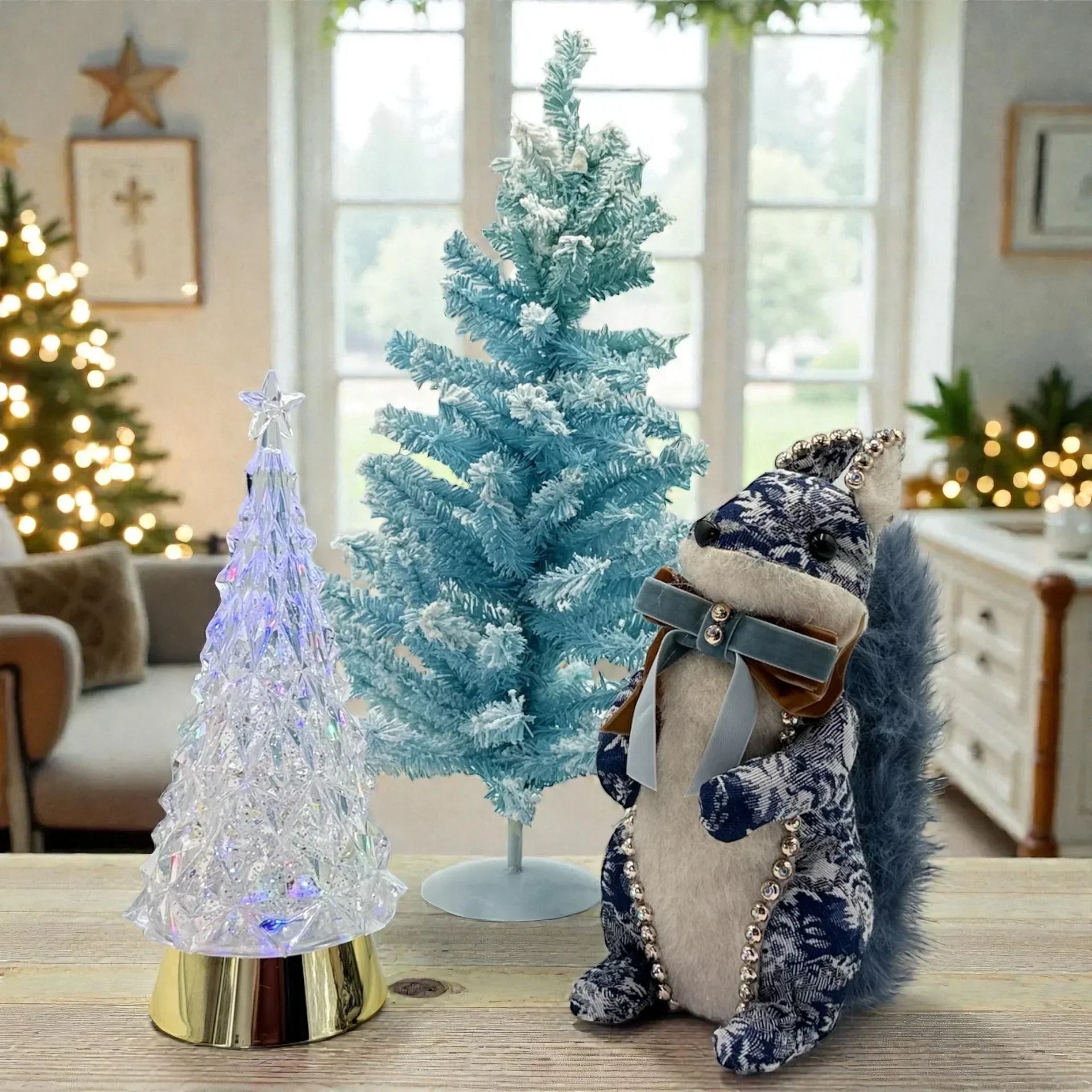 Frosted blue Christmas tree, crystal light-up tree, and festive squirrel decoration for holiday home décor