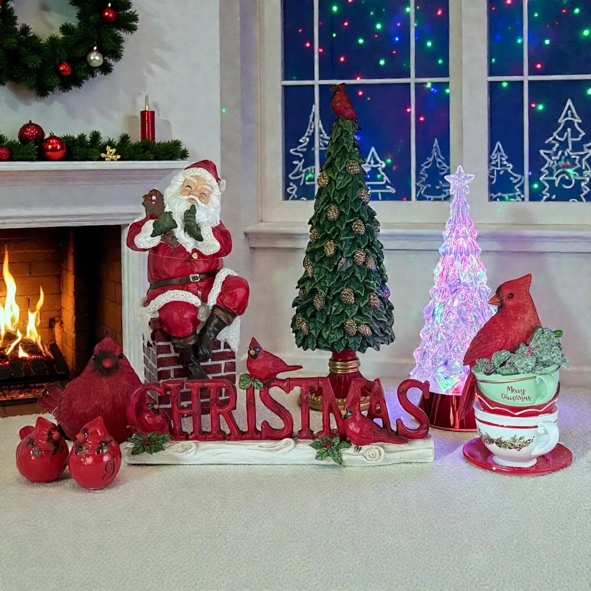Festive Christmas decor with Santa figurine, cardinal birds, pine tree, and glowing tree near fireplace