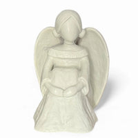 White ceramic angel figurine with wings, holding a heart, for home décor and vintage-inspired interiors.