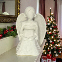 White angel statue with wings, festive Christmas decor, holiday home accents, elegant interior design