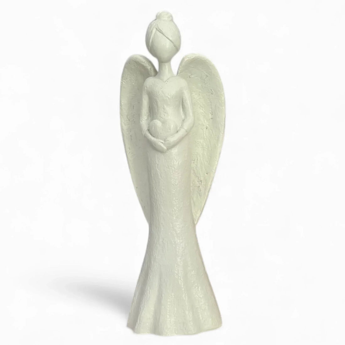 White angel figurine holding heart, elegant home décor accent