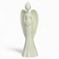White angel figurine holding heart, elegant home décor accent