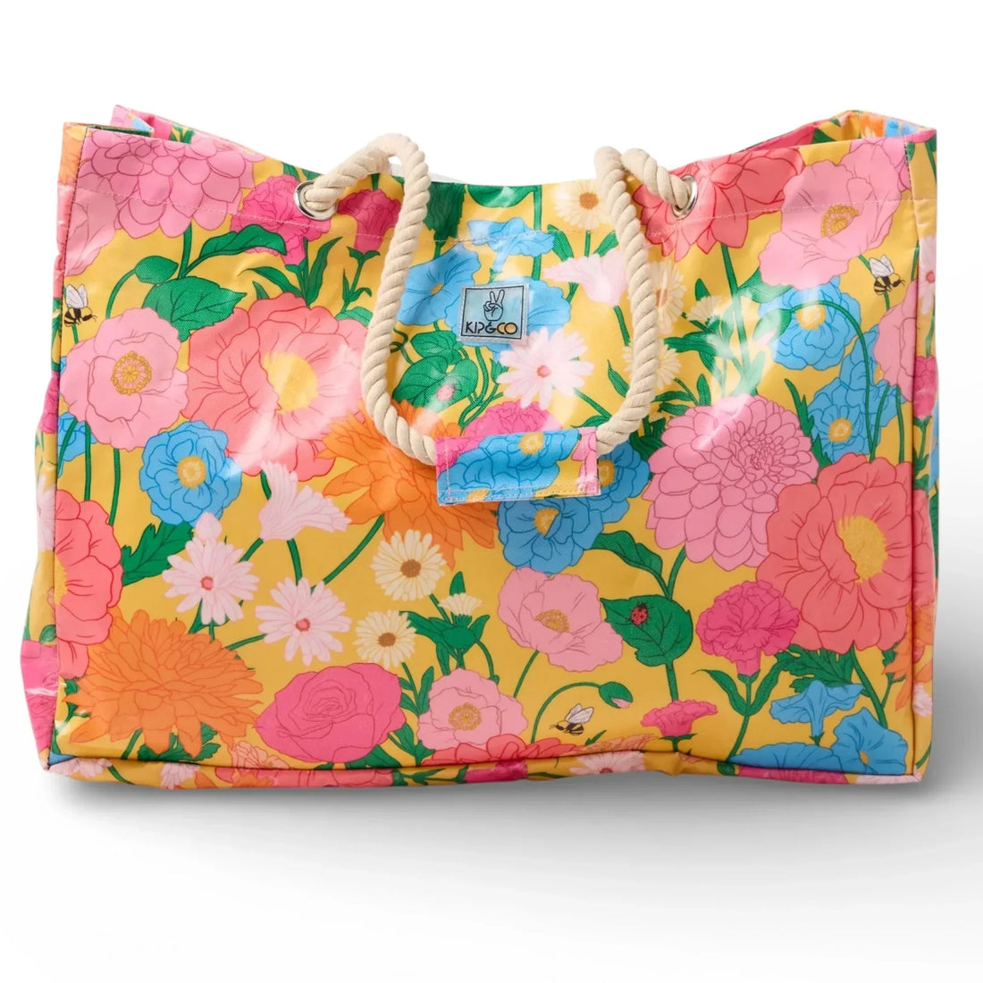Vibrant floral tote bag with rope handles, featuring pink, blue, and orange blooms on yellow background