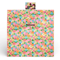 Colorful floral picnic blanket with carry strap, perfect for outdoor gatherings and garden parties