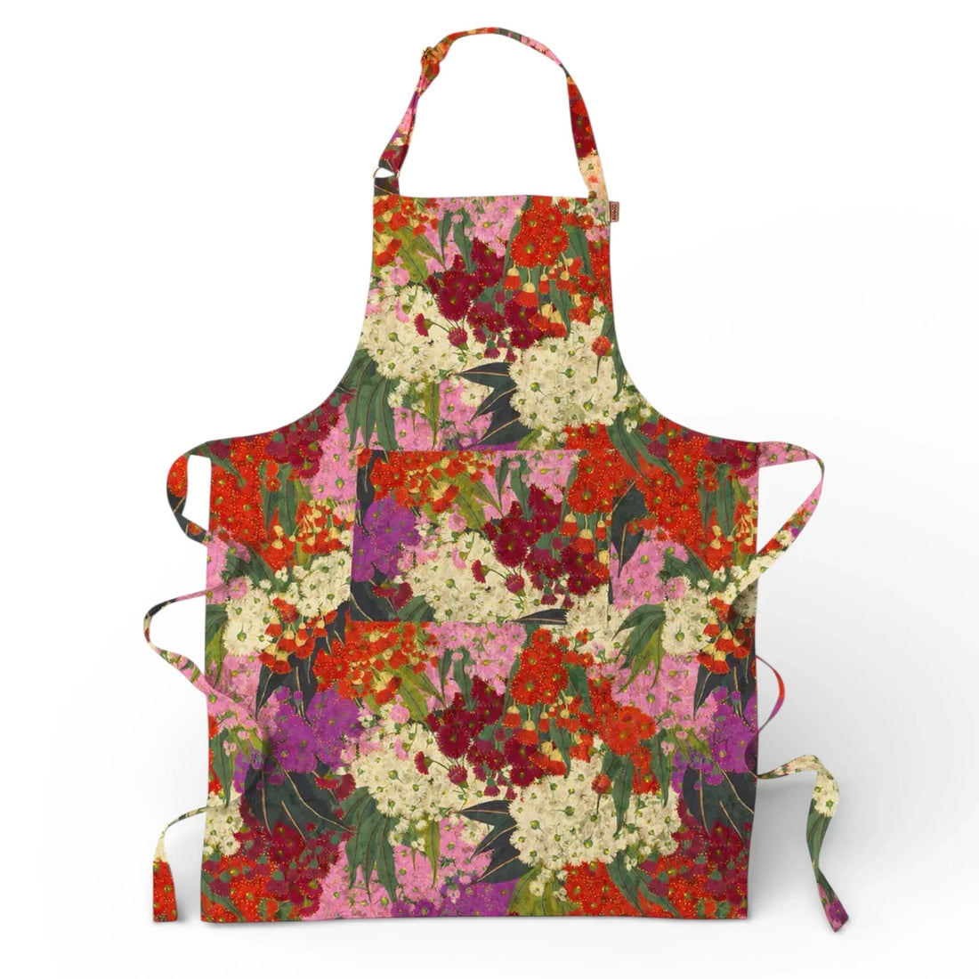 Vibrant floral print apron with red, pink, purple & white blooms, perfect for kitchen décor or cooking.