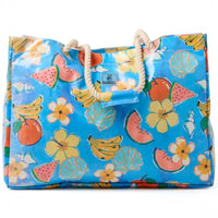 Blue beach tote bag with watermelon, bananas, flowers, and seashells print, rope handles