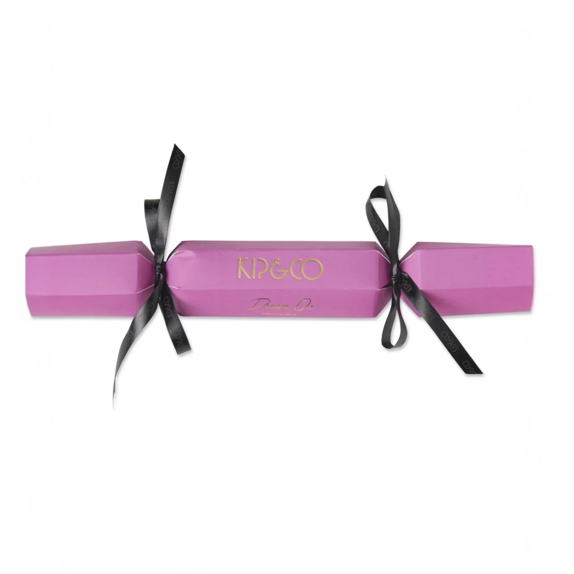 Pink KIP&CO Dream On luxury Christmas cracker with black ribbon, festive home décor