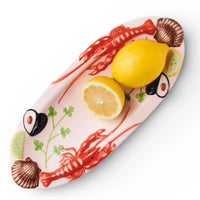 Ceramic seafood platter with lobsters, lemons, shells & herbs for elegant home dining