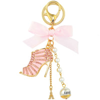 Pink high heel keychain with rhinestones, pearl beads, Eiffel Tower charm, and 'LOVE' pendant, perfect for fashion lovers.