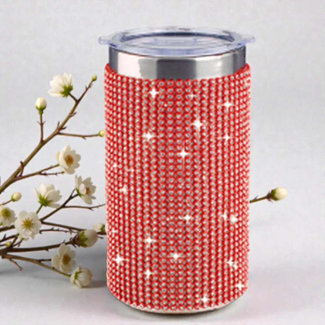 Red rhinestone tumbler sleeve with star accents, perfect for elegant home décor or gifting