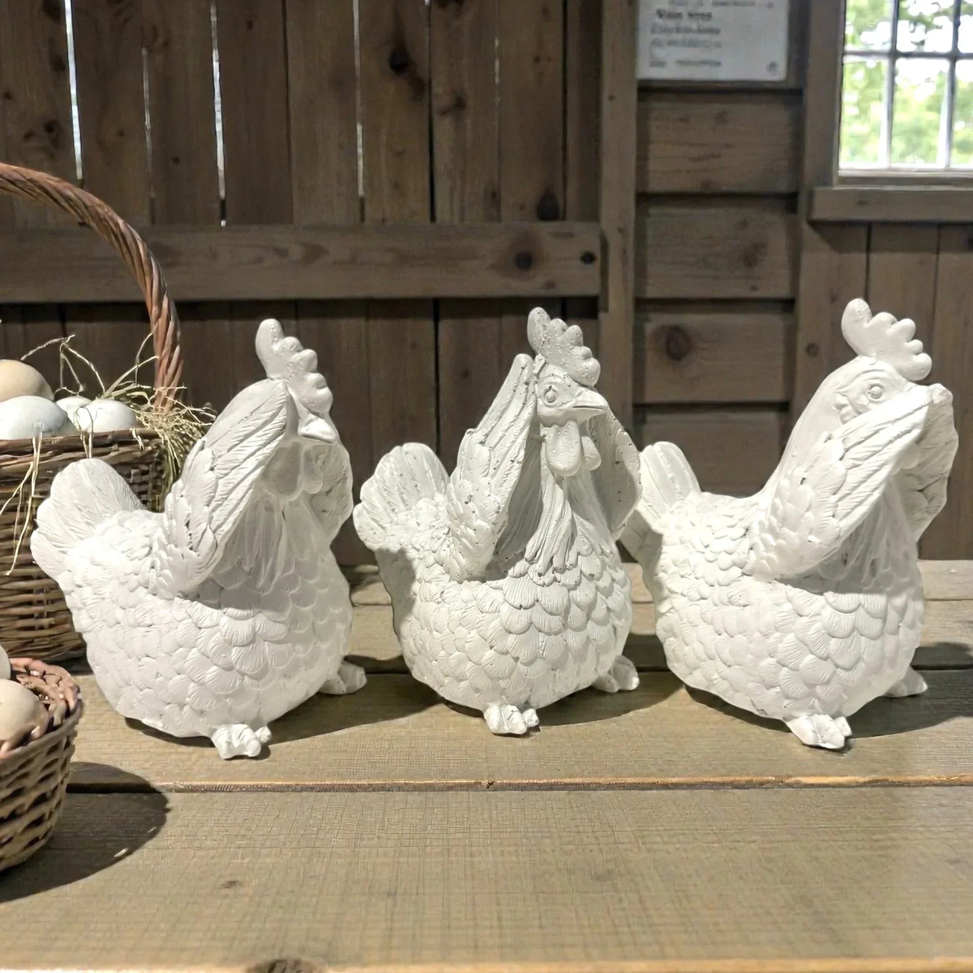 White ceramic chicken figurines for farmhouse kitchen decor, rustic home accents with wicker basket
