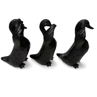 Three black duck figurines in wise monkey poses, home décor accents for elegant interiors