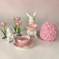 Pink and white ceramic bunny decor with tulips, flower bowl, and floral sphere for spring home styling