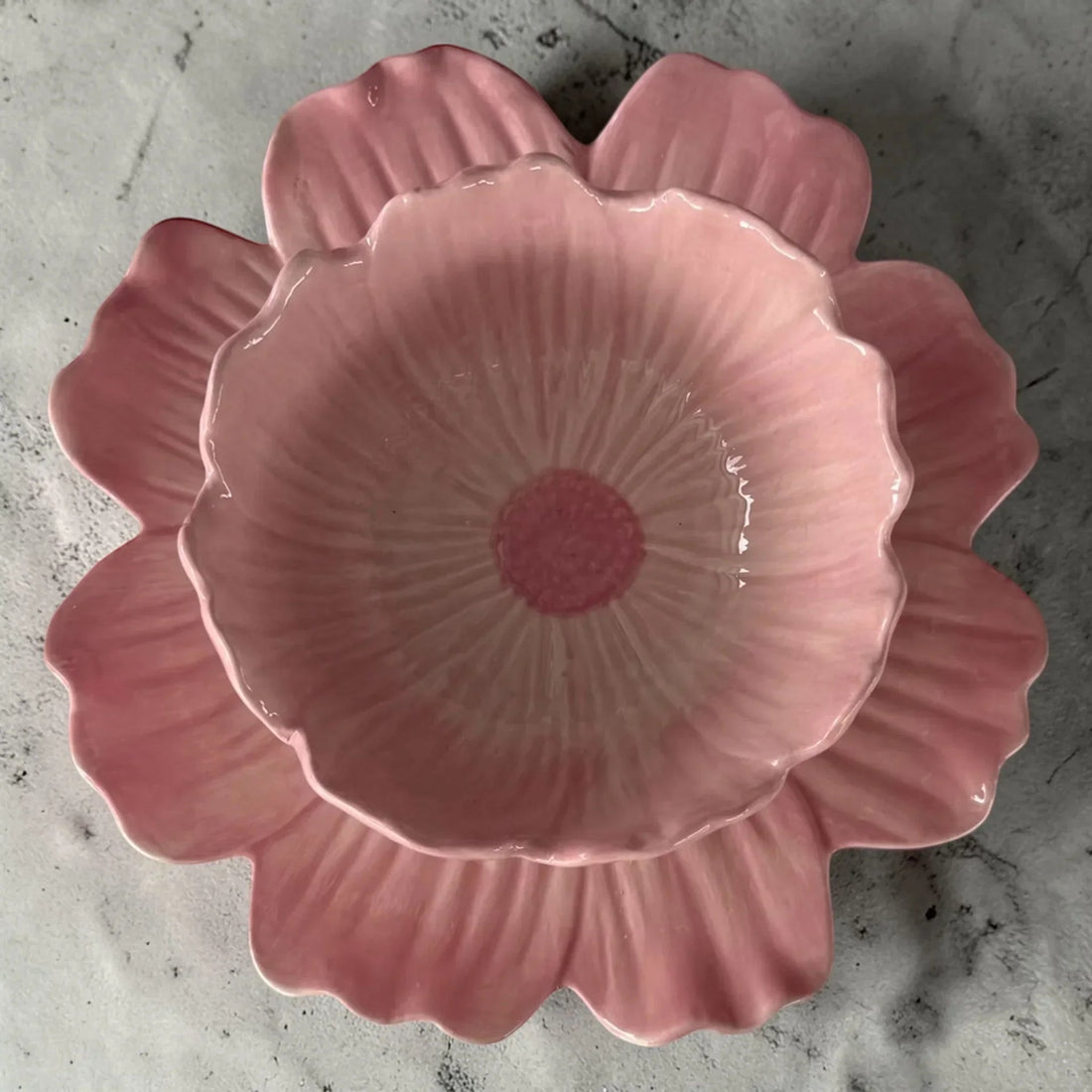 Pink ceramic flower-shaped bowl with petal design, perfect for home décor or serving