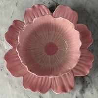 Pink ceramic flower-shaped bowl with petal design, perfect for home décor or serving