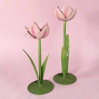 Pink metal tulip home decor with green stems and leaves, elegant spring accent for living spaces