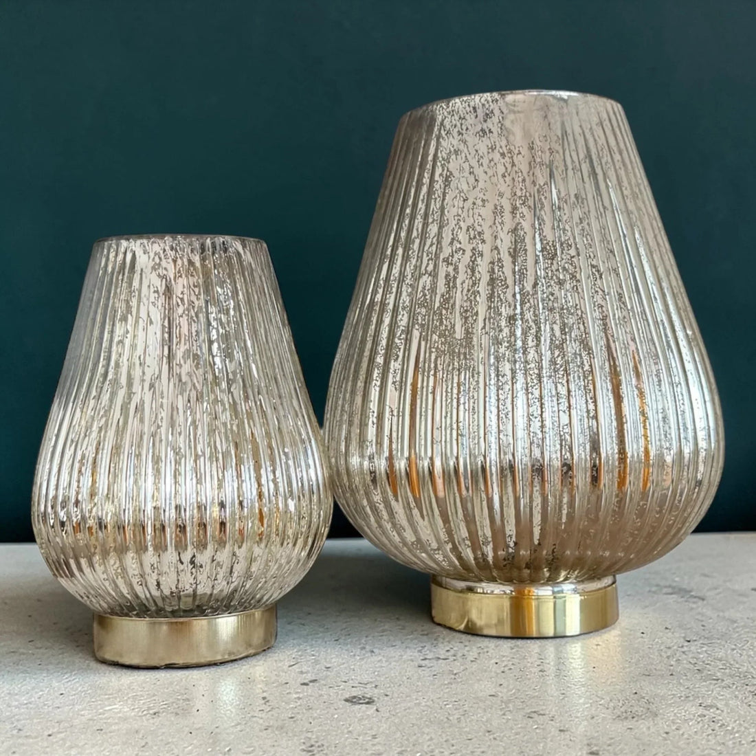 Set of two ribbed mercury glass vases with gold bases, elegant home décor accents