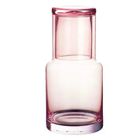 Pink glass vase with modern design, perfect for home décor and floral arrangements