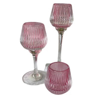 Pink ribbed glass candle holders, vintage-style home décor with elegant stems and bases