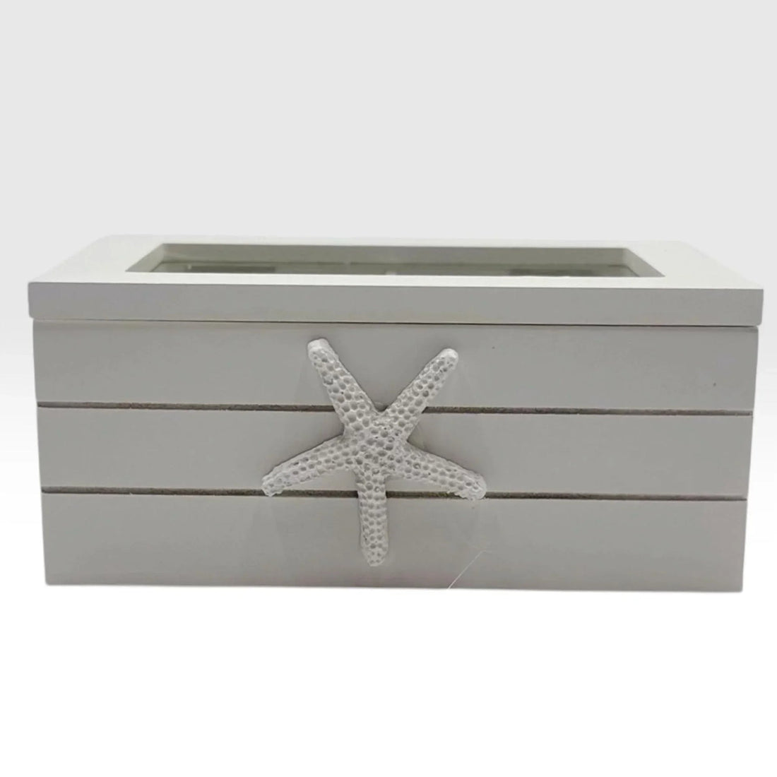 White coastal-style storage box with starfish accent, perfect for beach home décor and vintage-inspired interiors.