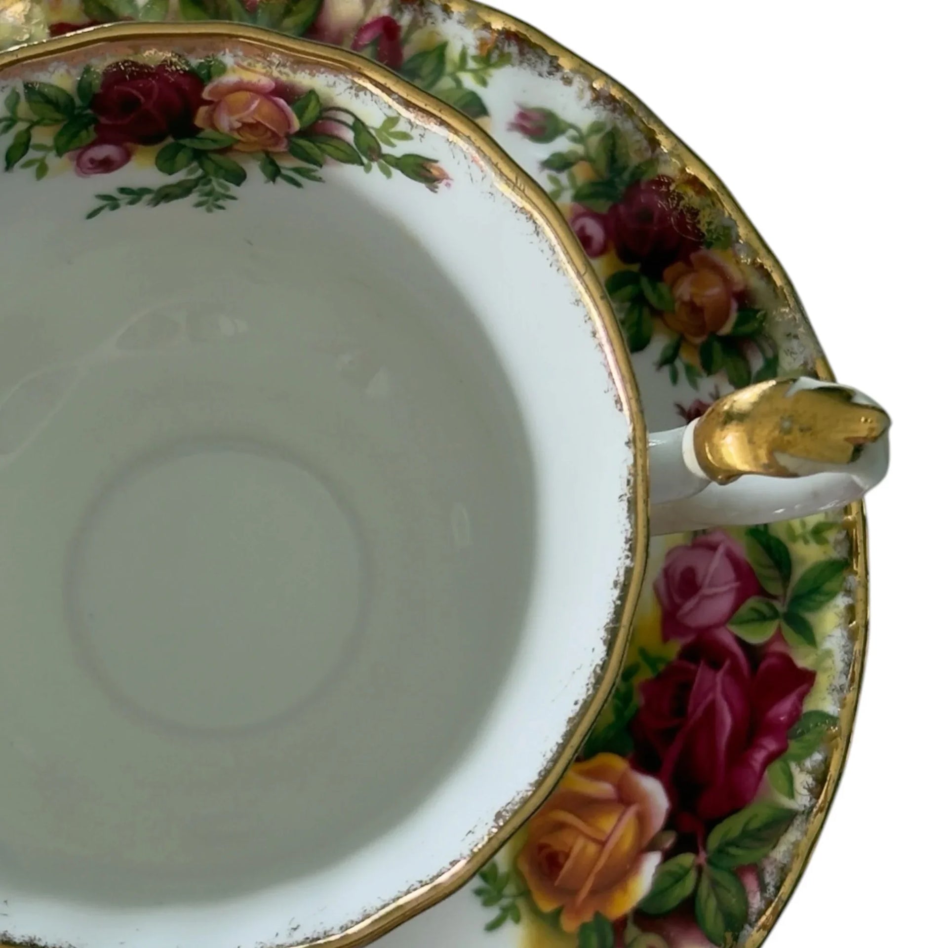 Vintage porcelain teacup with rose floral pattern and gold trim, elegant home décor accent