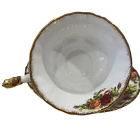 Vintage floral teacup with gold trim and rose pattern, elegant home décor accent