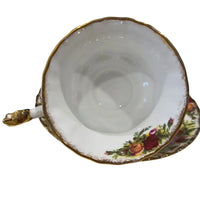 Vintage floral teacup with gold trim and rose pattern, elegant home décor accent
