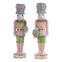Pastel Easter bunny nutcrackers with floral hats, holding eggs and basket, home décor accent pieces