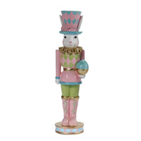 Pastel Easter bunny nutcracker holding egg, vintage home décor with pink, green, and blue harlequin design