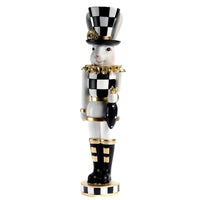Elegant black and white checkered rabbit nutcracker with gold accents, vintage home décor accent piece