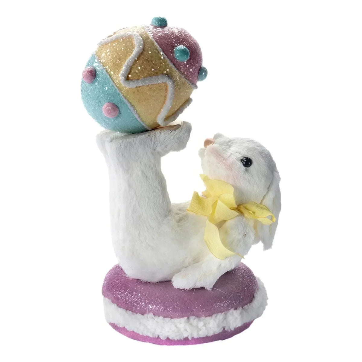 White bunny figurine with yellow bow holding glittery pastel Easter egg, home décor accent
