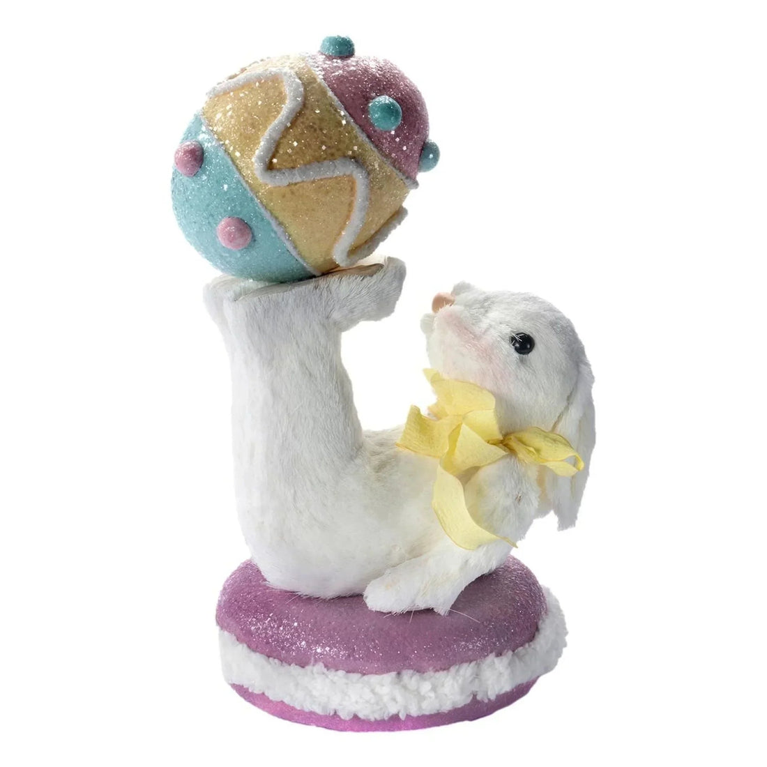 White bunny figurine with yellow bow holding glittery pastel Easter egg, home décor accent