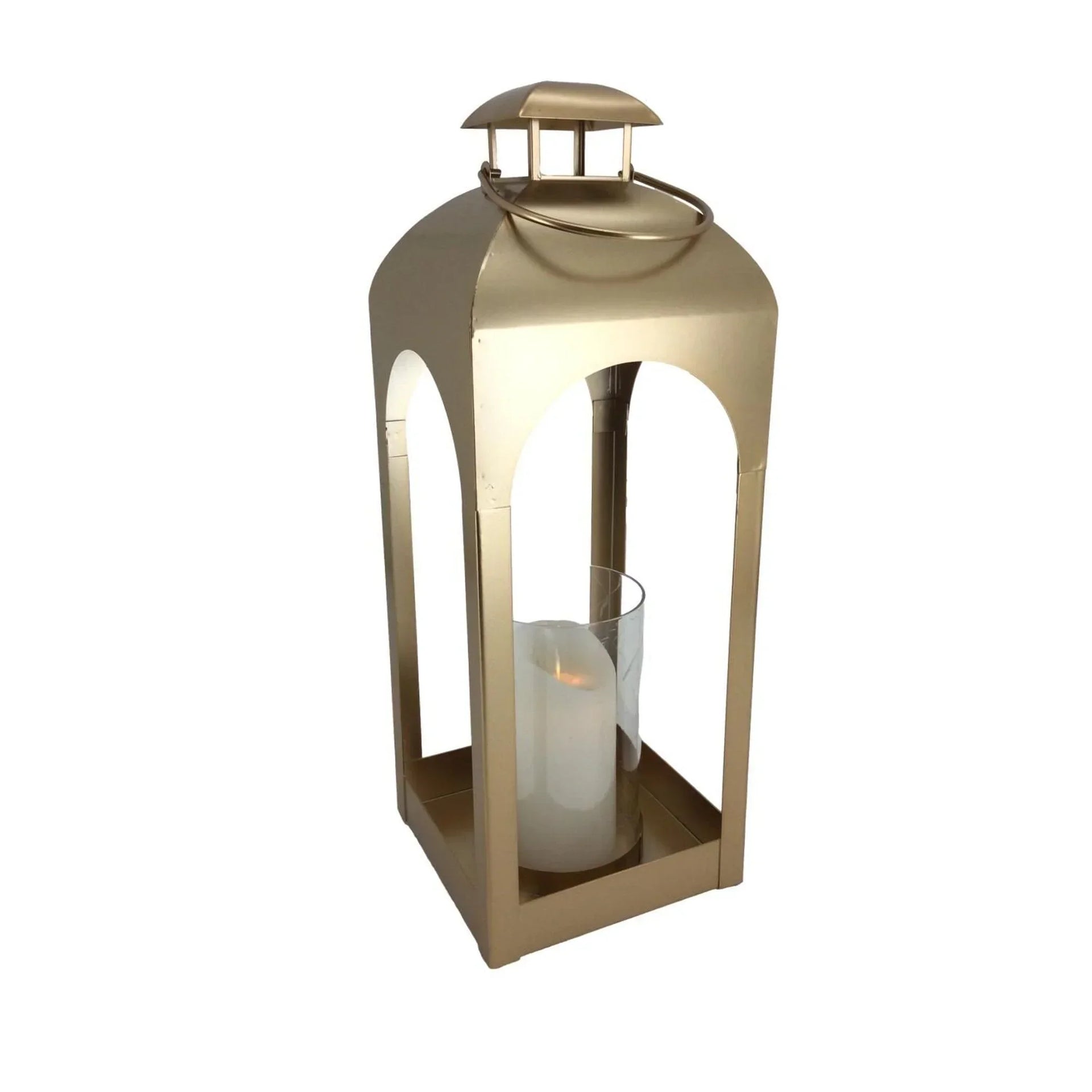 Gold metal lantern with arched cutouts holding a white candle, elegant home décor accent