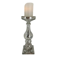 Mercury glass candle holder with vintage-inspired design, perfect for elegant home décor and ambient lighting.