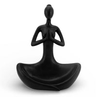 Black meditation figurine in lotus pose, serene home décor for mindfulness and zen space