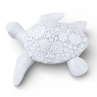 White ceramic turtle sculpture with floral shell pattern, elegant home décor accent piece