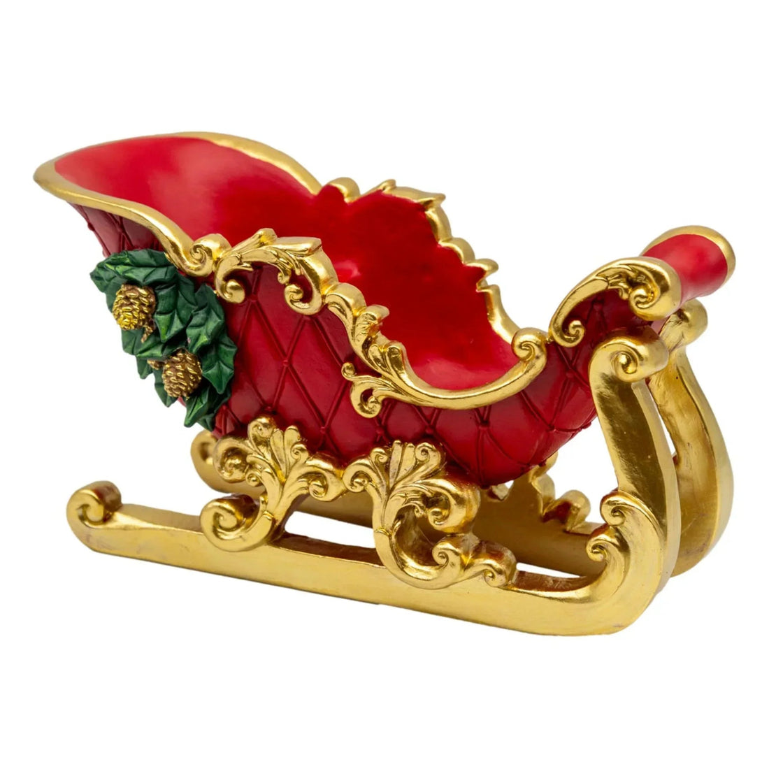 Red and gold ornate sleigh with holly, festive holiday décor