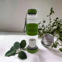 Green Kuvings infuser water bottle with tea strainer, perfect for home or travel