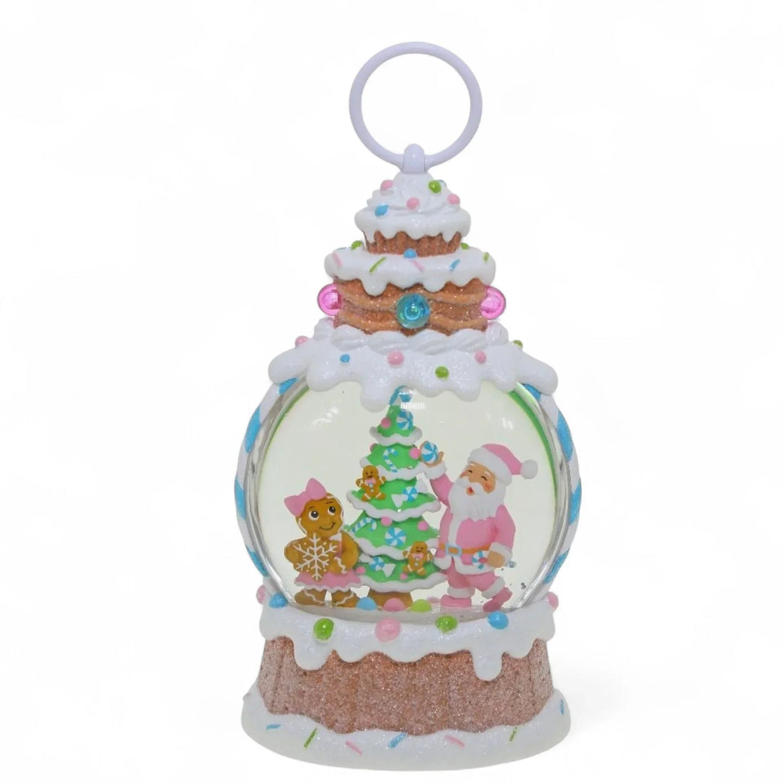 Cute Christmas snow globe with Santa, gingerbread figures, and candy tree, cake-themed design